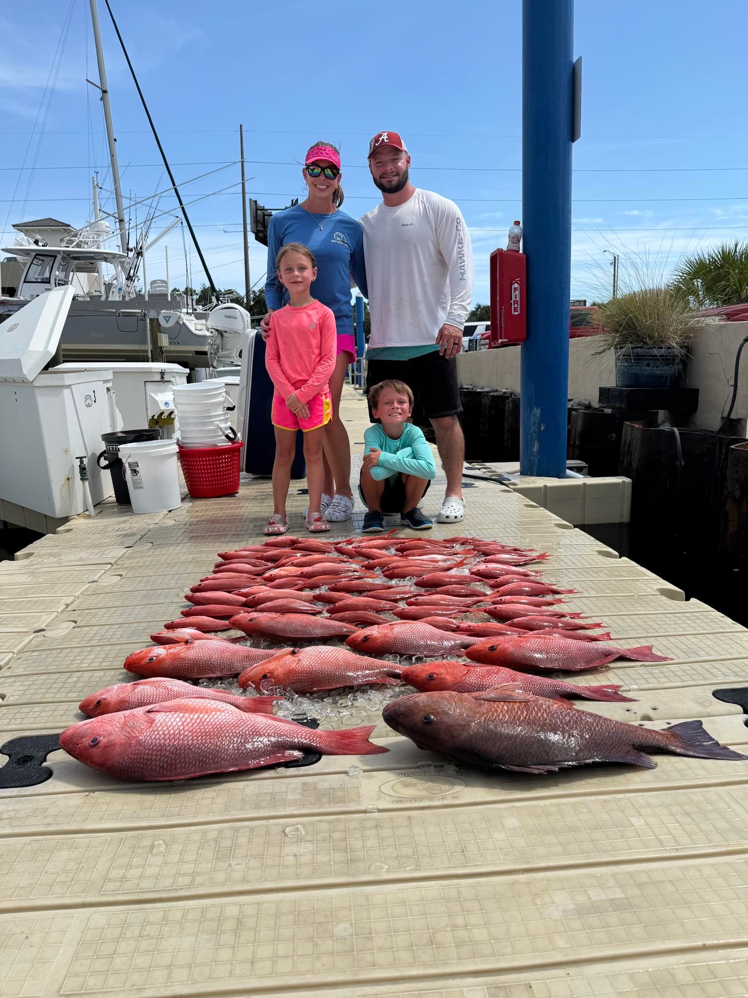 A group of 4 people fishing on the water