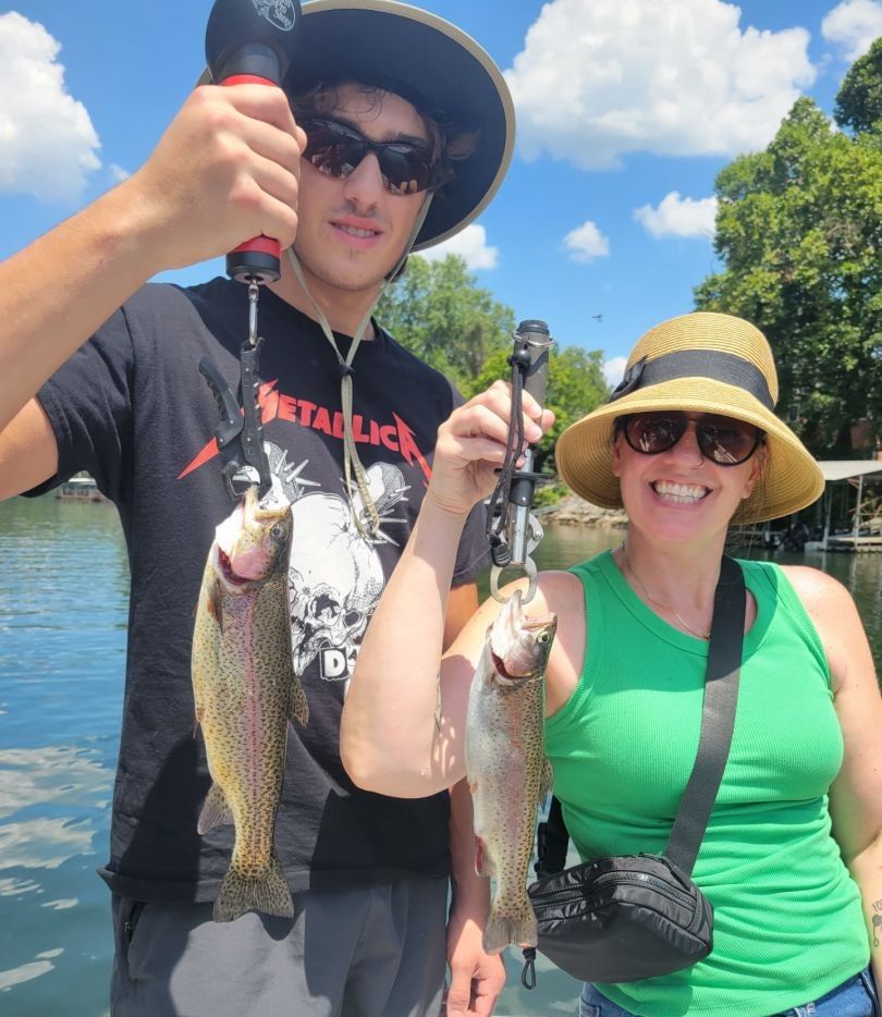 Two rainbow trout caught during fishing at an unknown location