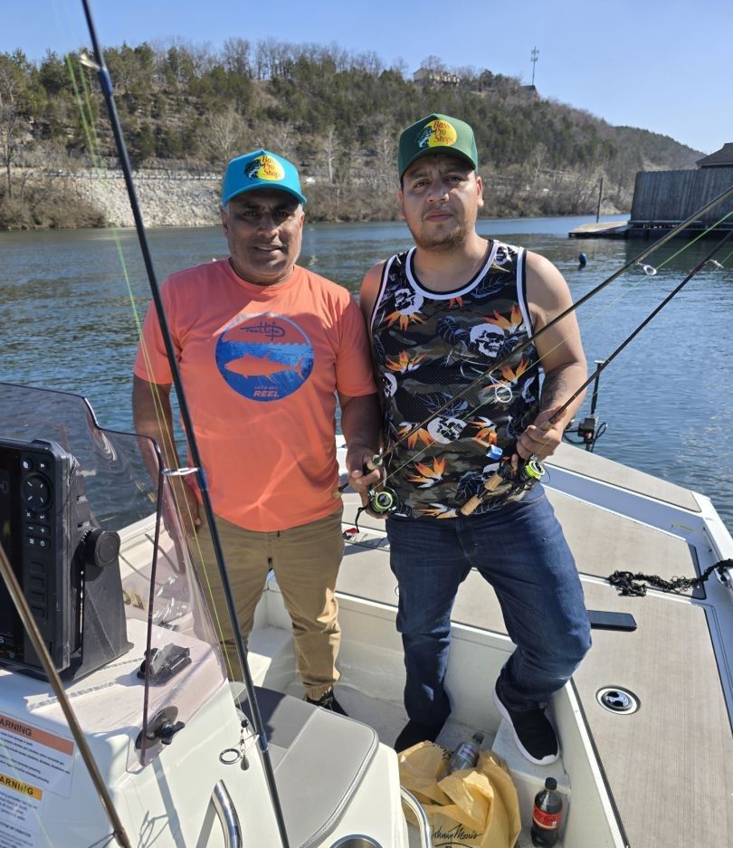 Two people fishing in a scenic location