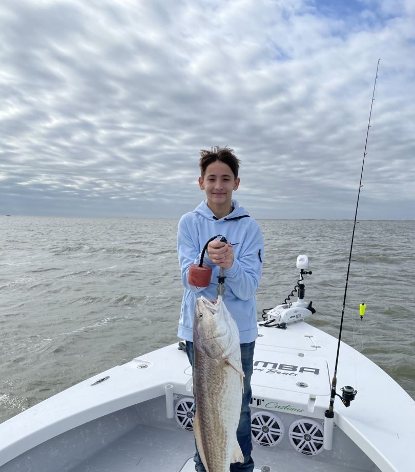 Person fishing in unknown location