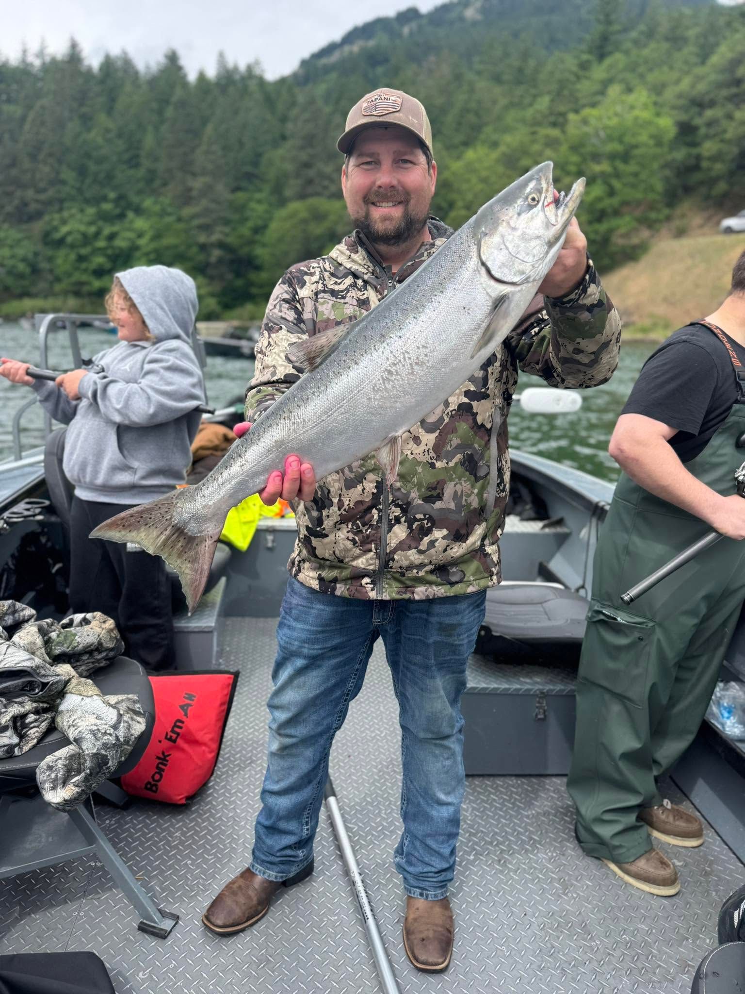 Large Chinook salmon catch displayed on fishing boat deck