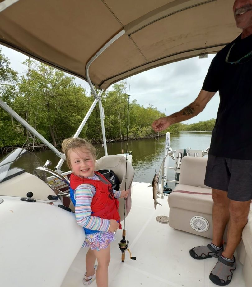 Angler fishing on the shore with unknown location