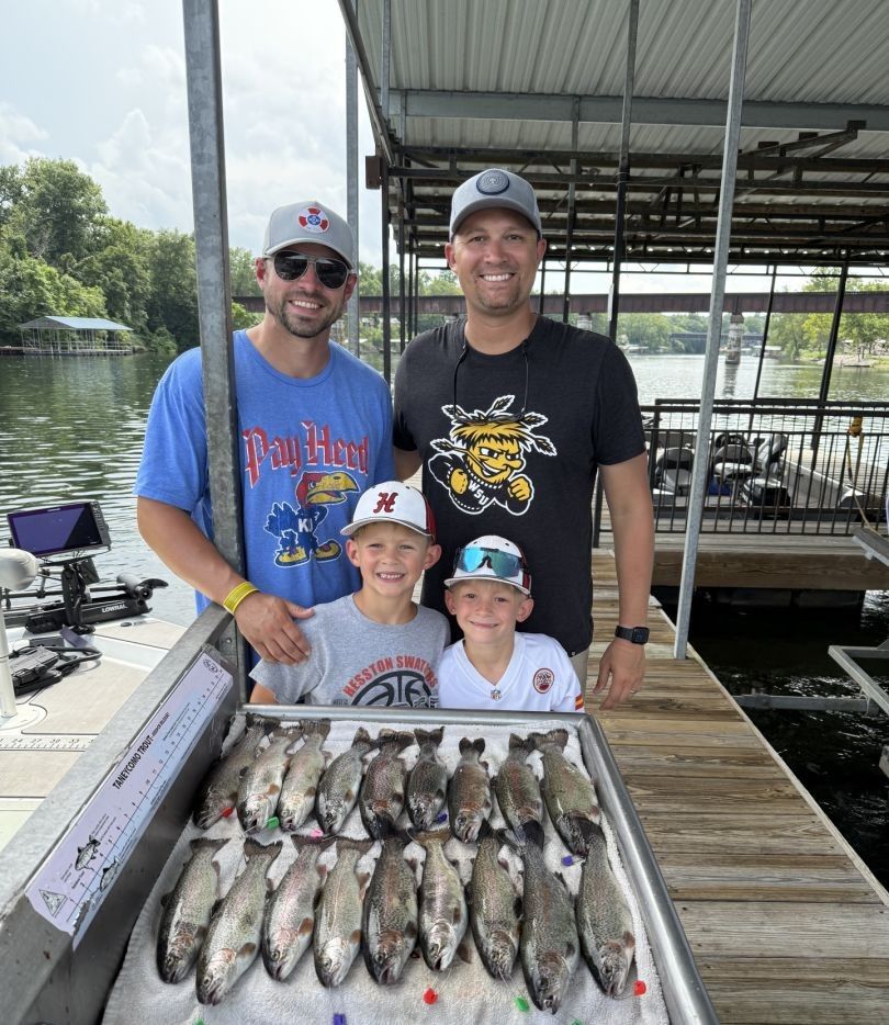 4 people fishing at an unknown location