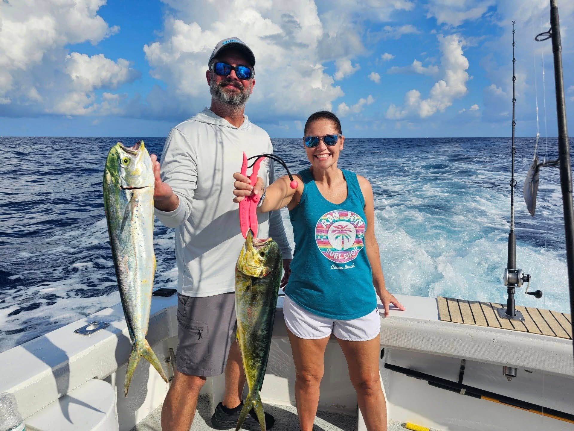 Two people fishing at an unknown location