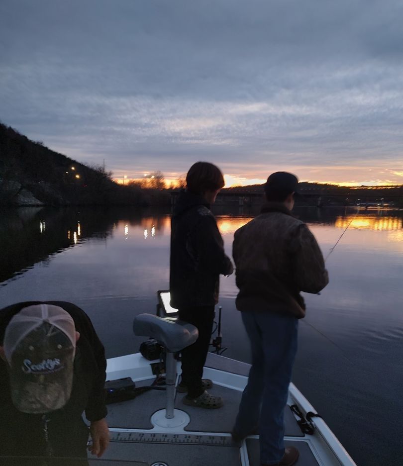 Person fishing in unknown location.
