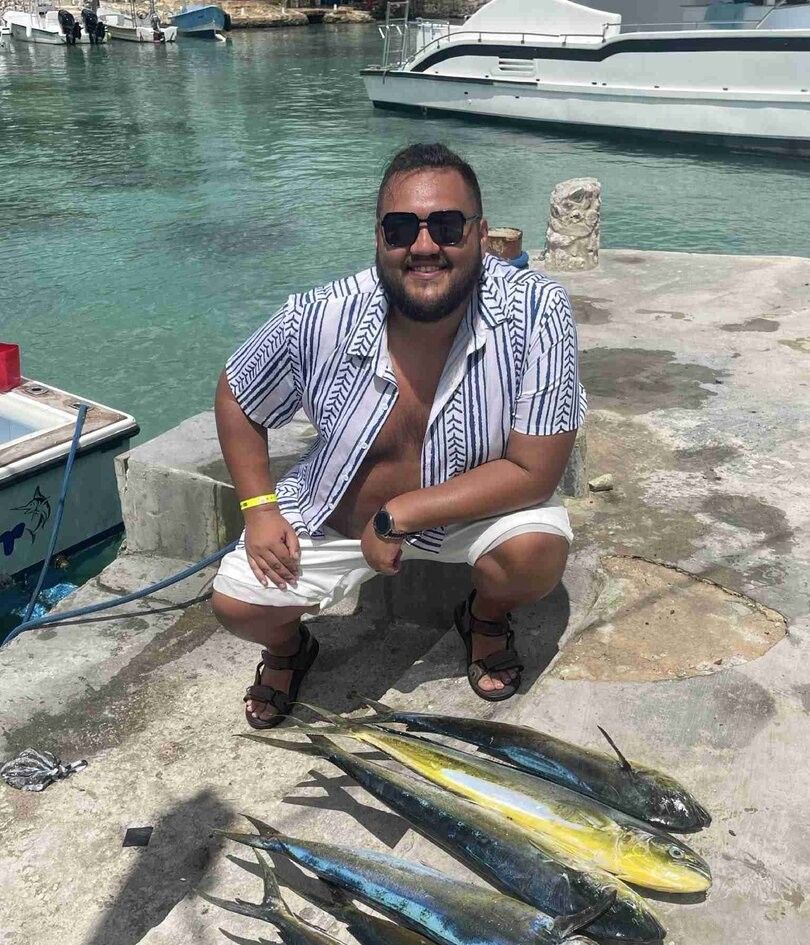 Fisherman casting line in unknown location