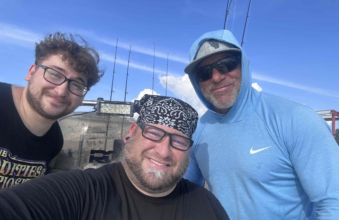 Three people fishing in a scenic location