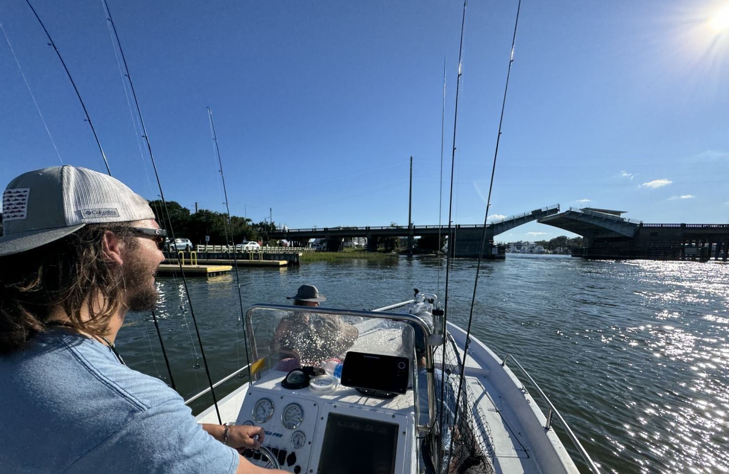 Two people fishing near an unknown location