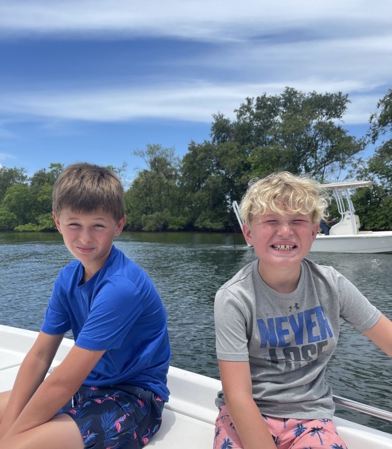 Two people fishing in a scenic location