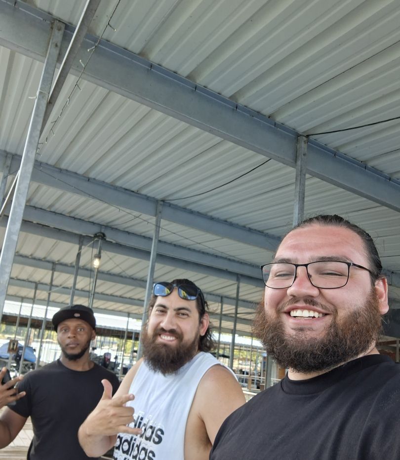 Three people fishing in an unknown location