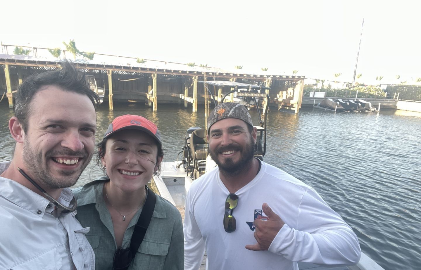 Three people fishing at an unknown location