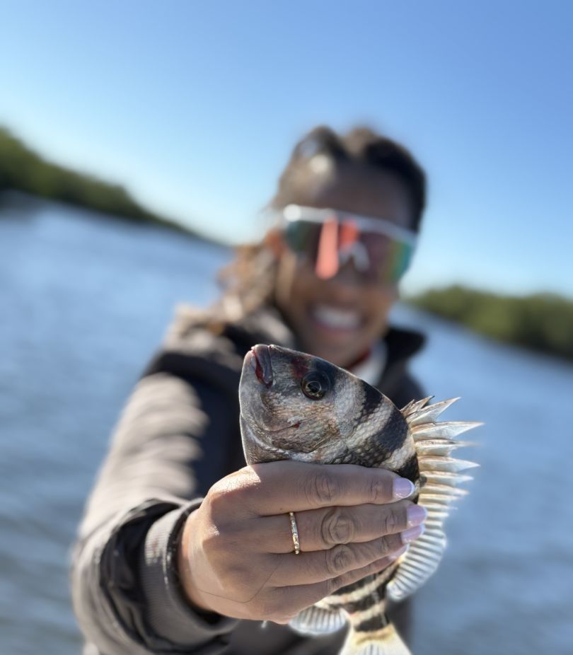 Lone angler fishing in unknown location