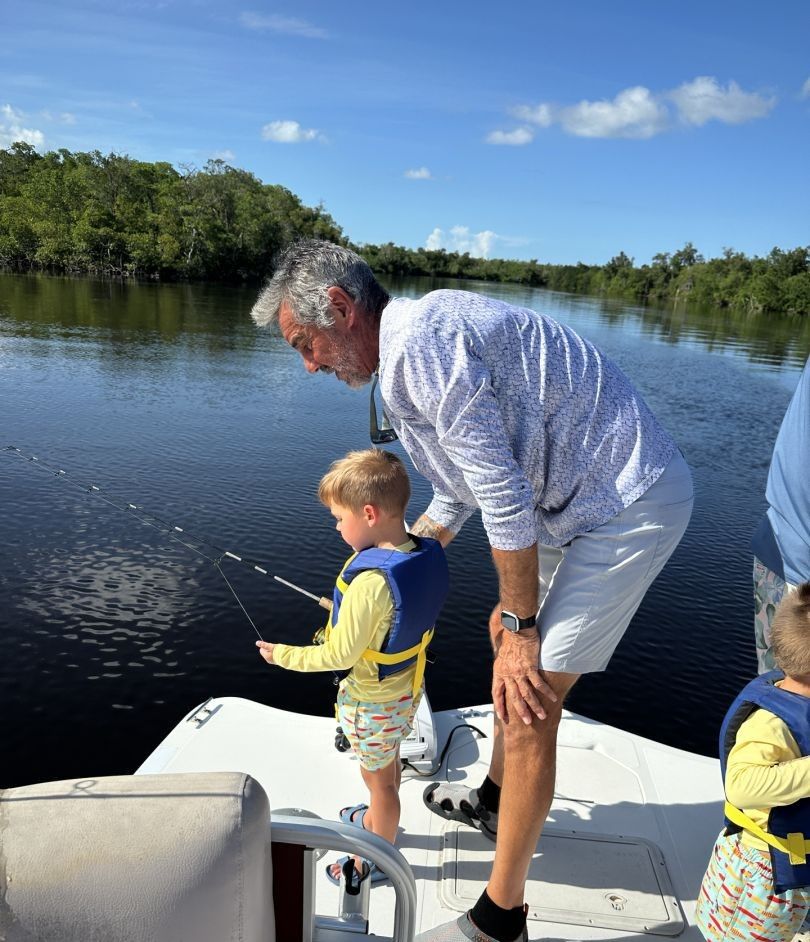 A person fishing in an unknown location.