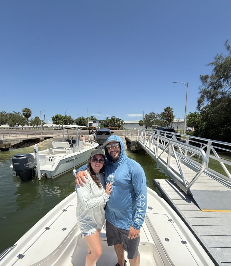 Two people fishing at a scenic location