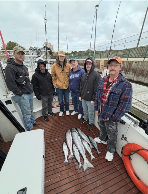 Group of 6 people fishing in an unknown location