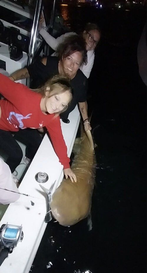 Two people fishing in an unknown location