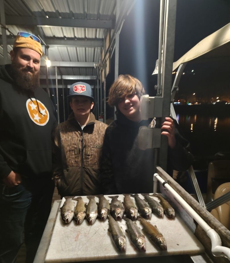 Three people fishing in an unknown location