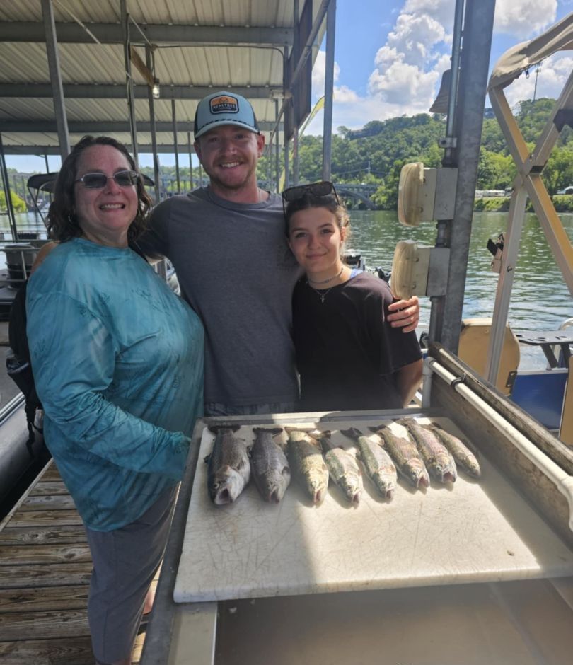 Three people fishing at an unknown location