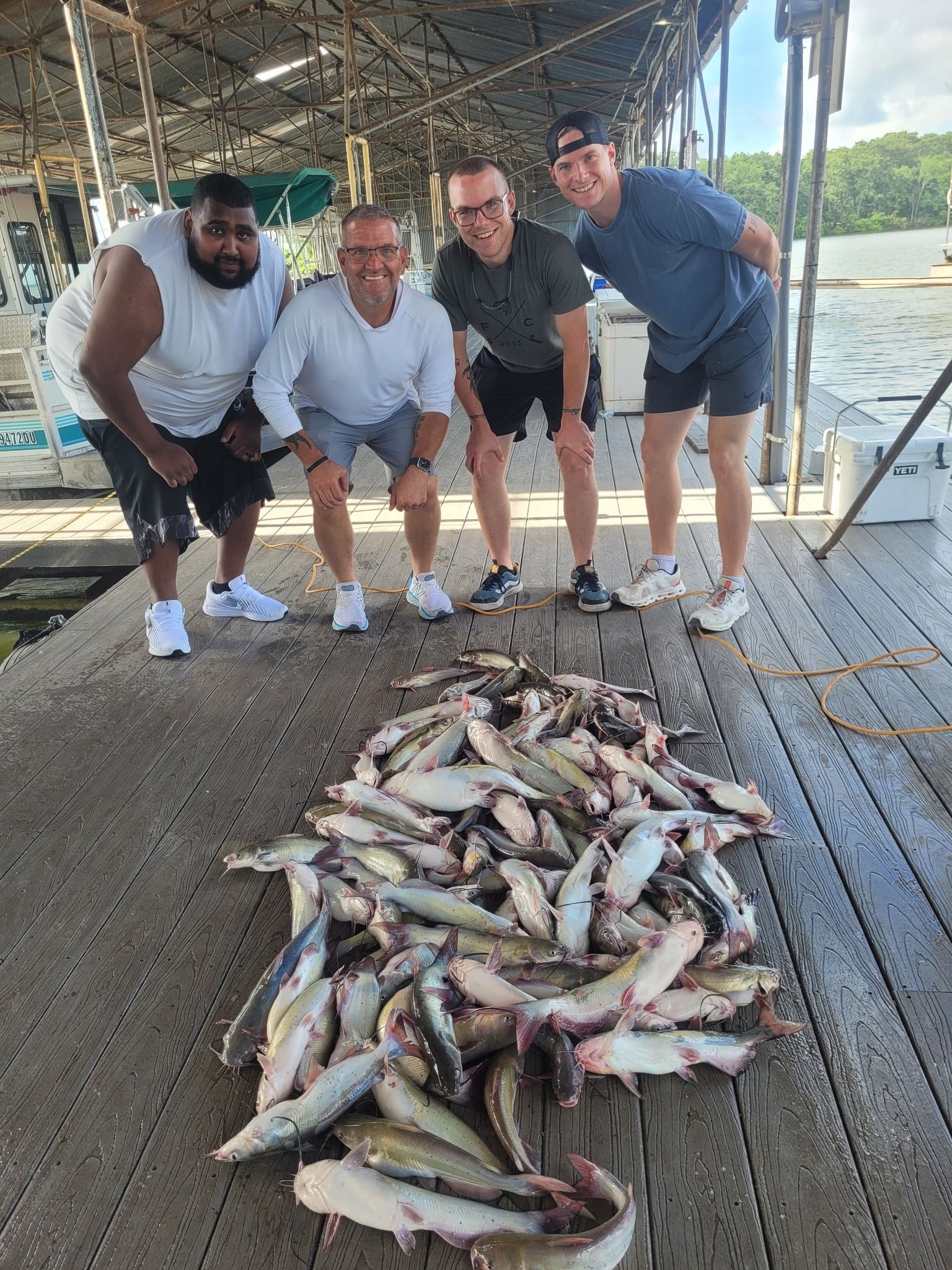 Four people fishing in an unknown location