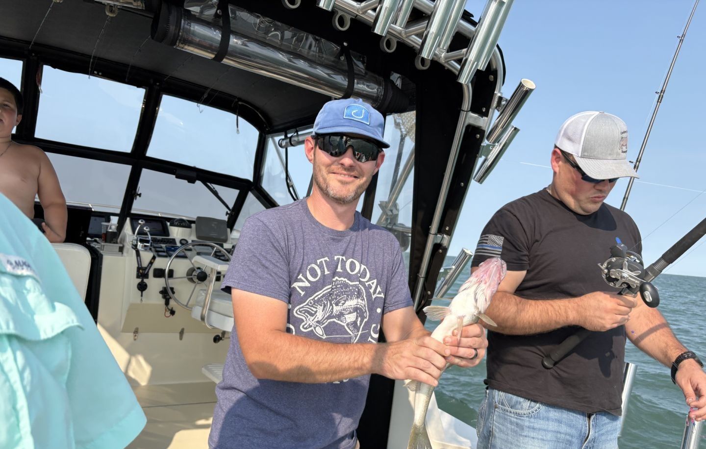 Two people fishing in a scenic location