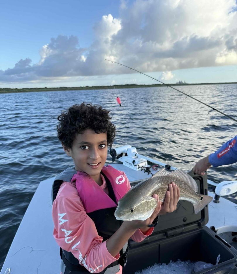 A lone angler fishing in an unknown location