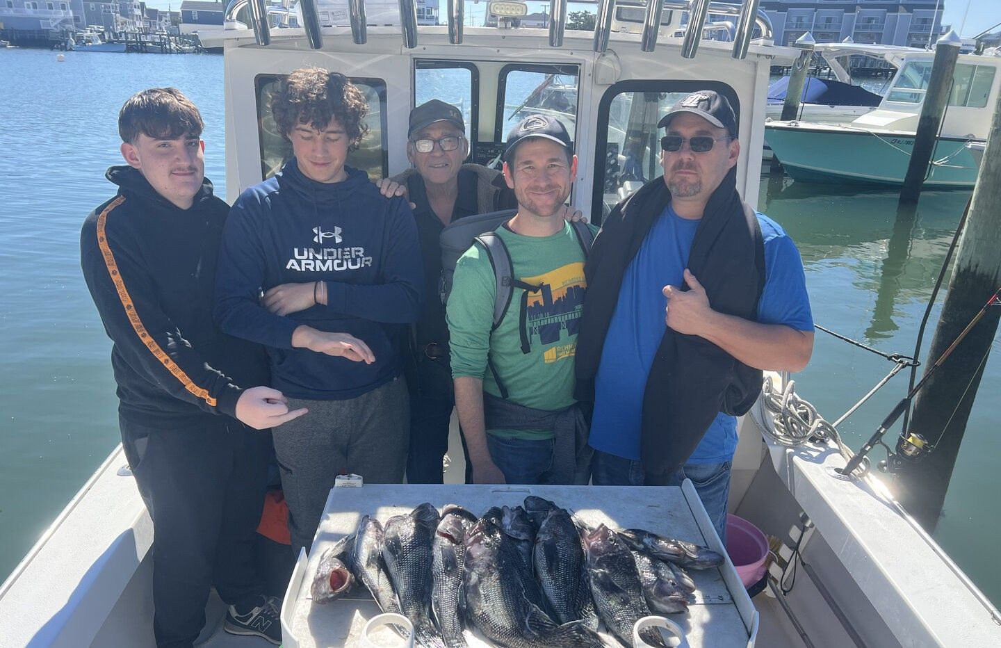 Fresh caught fish displayed in cooler on fishing boat at marina