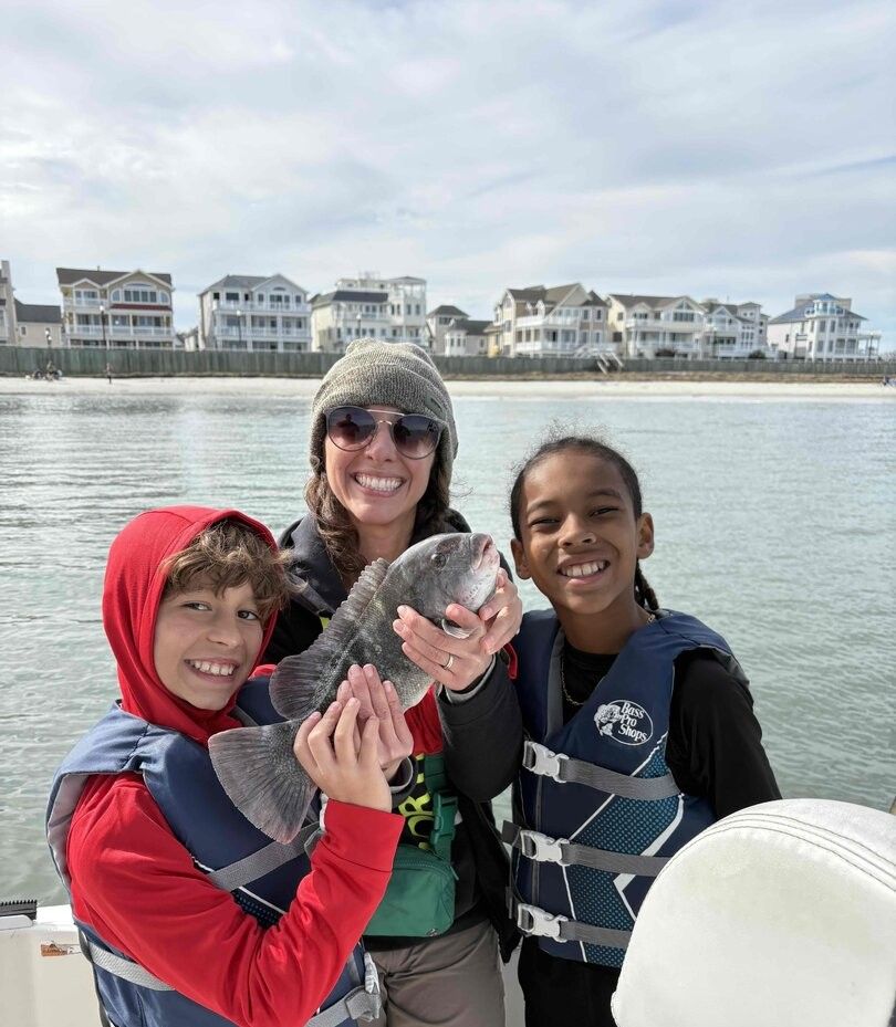 3 people fishing in an unknown location