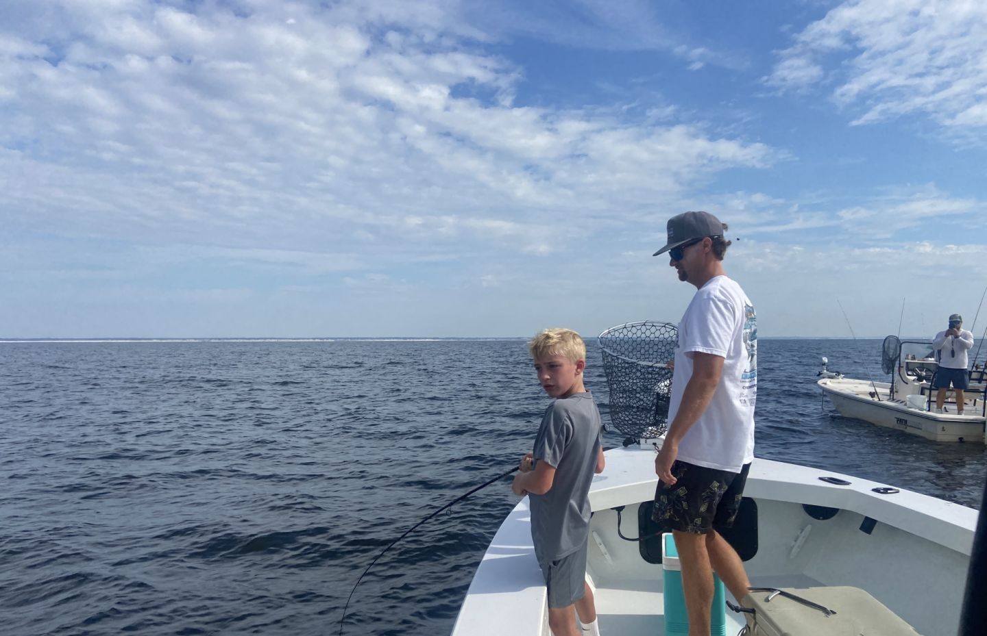 Three people enjoying a fishing trip