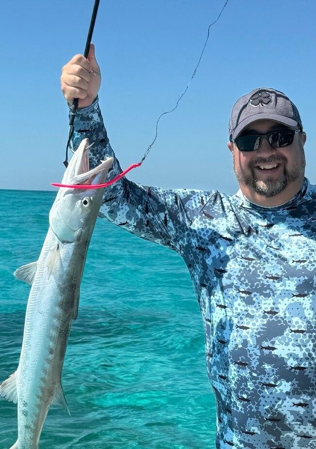 Great barracuda caught while fishing in clear blue ocean waters