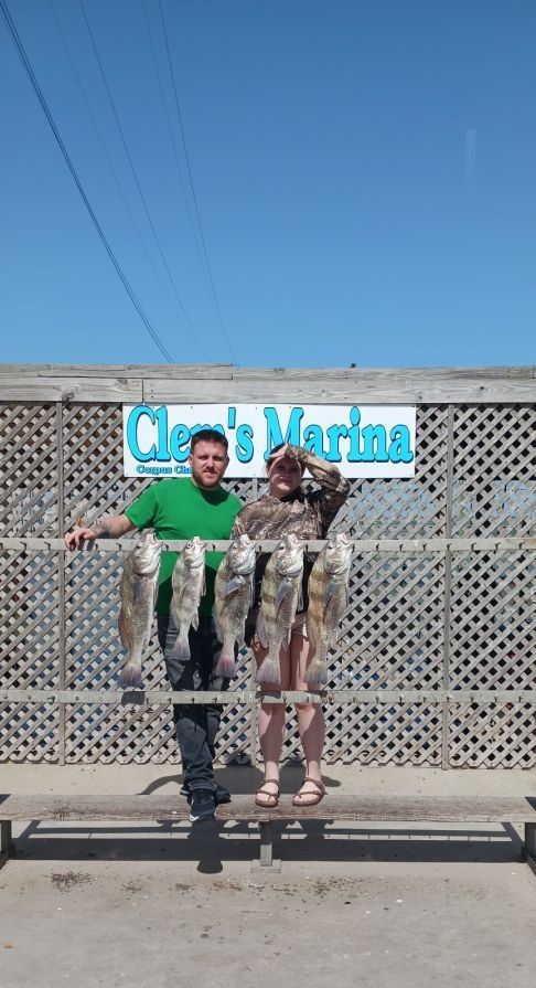 Two people fishing in an unknown location
