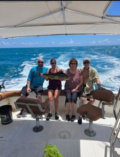 4 people fishing on unknown body of water