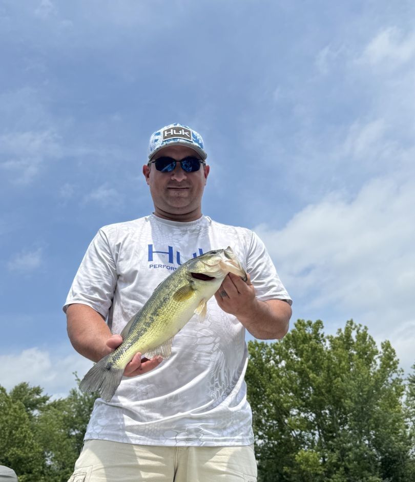 Angler fishing alone in an unknown location