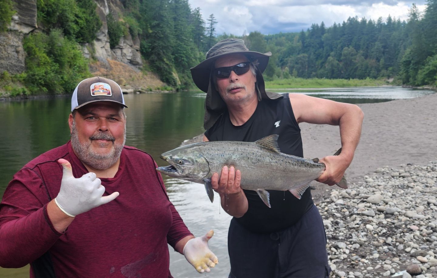 Angler holding a rainbow trout while fishing