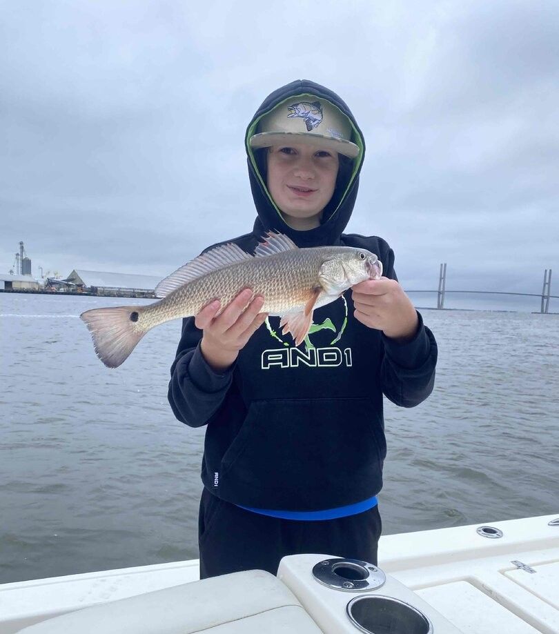 Redfish caught during fishing trip on boat in coastal waters