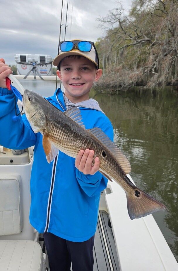 Redfish caught during outdoor fishing trip on boat