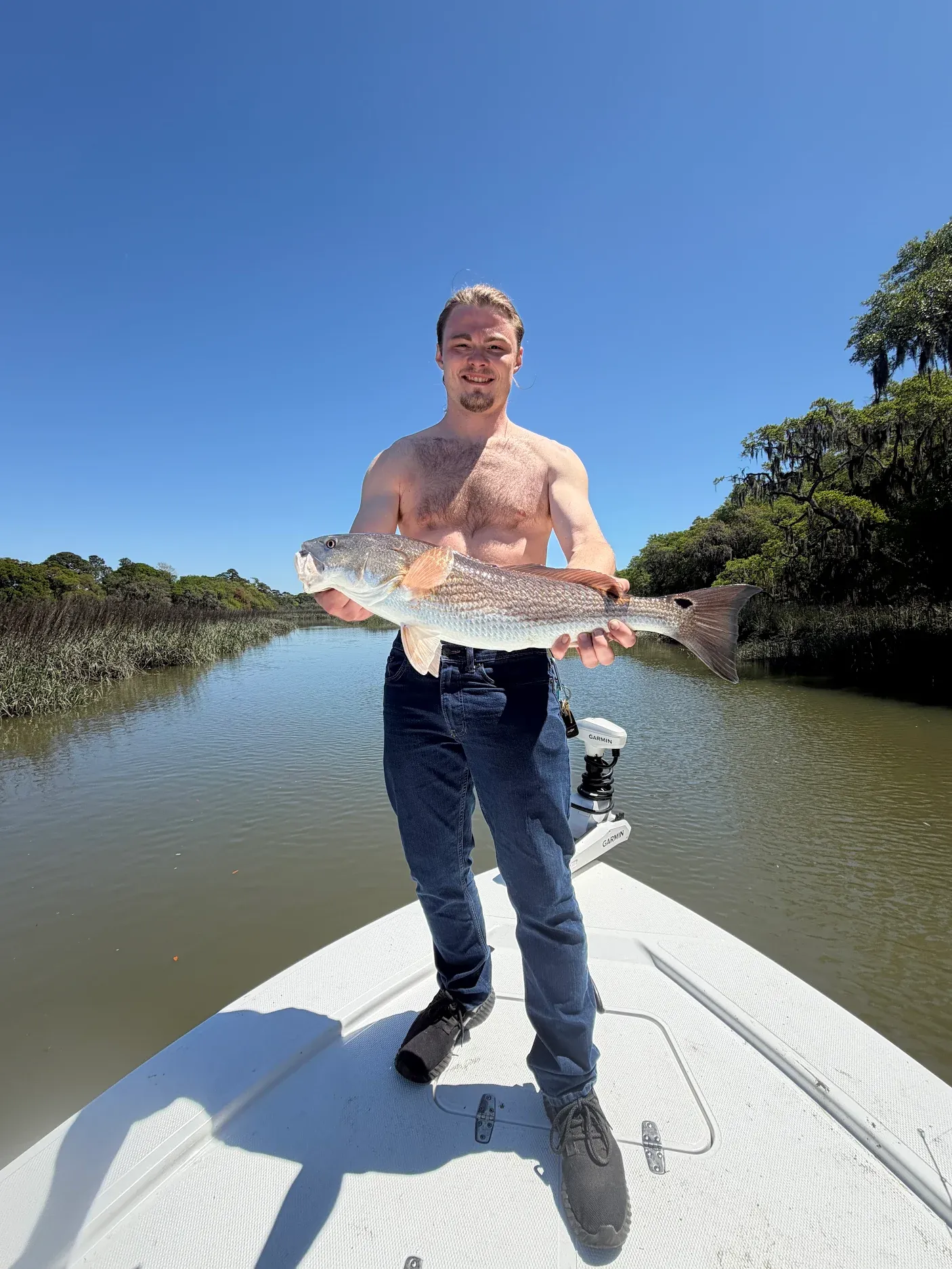 Successful redfish catch displayed on fishing boat in coastal waters