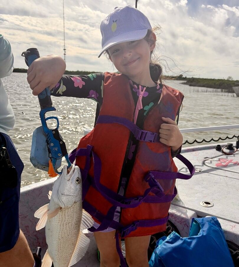 Redfish caught during outdoor fishing trip on boat