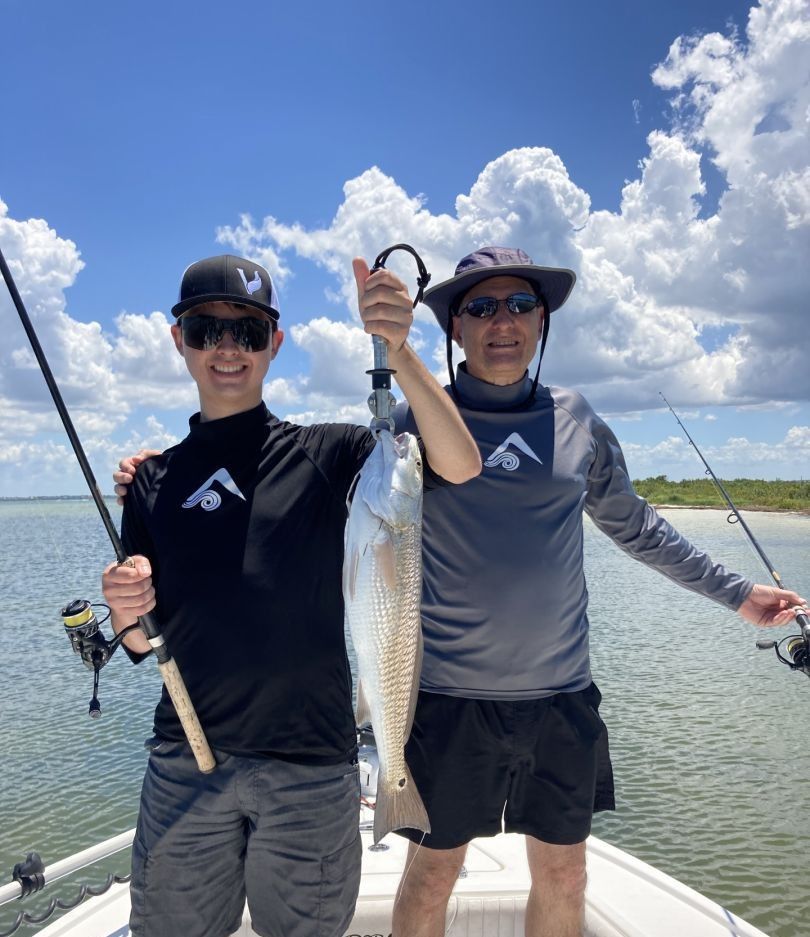 Redfish caught by two people