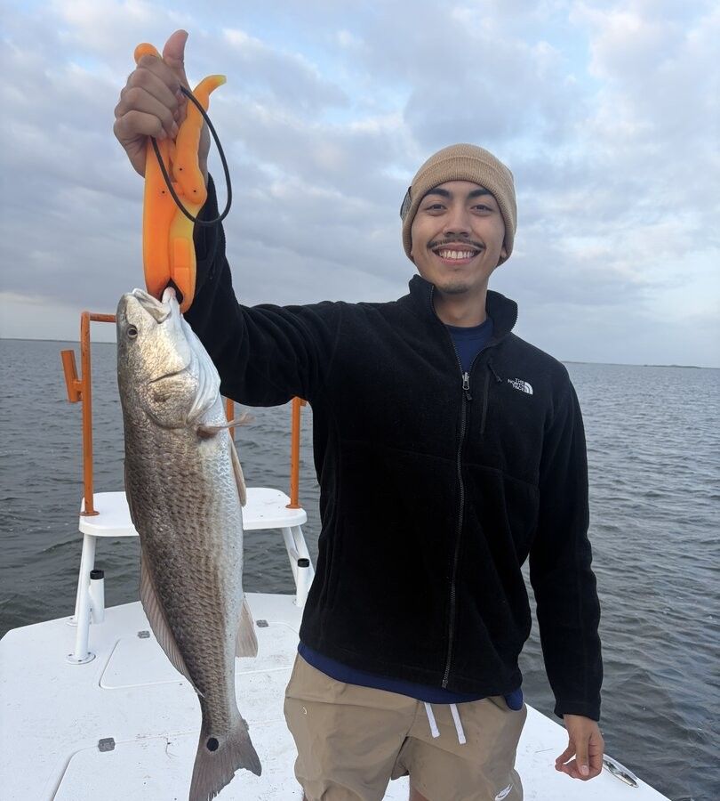 Angler catching a redfish