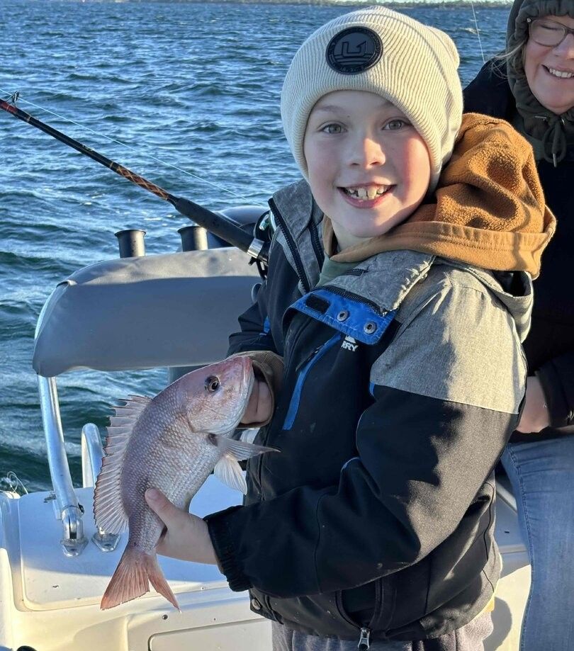 Two people fishing in a scenic location