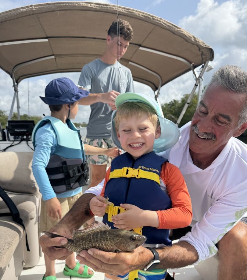 3 people fishing in a scenic location