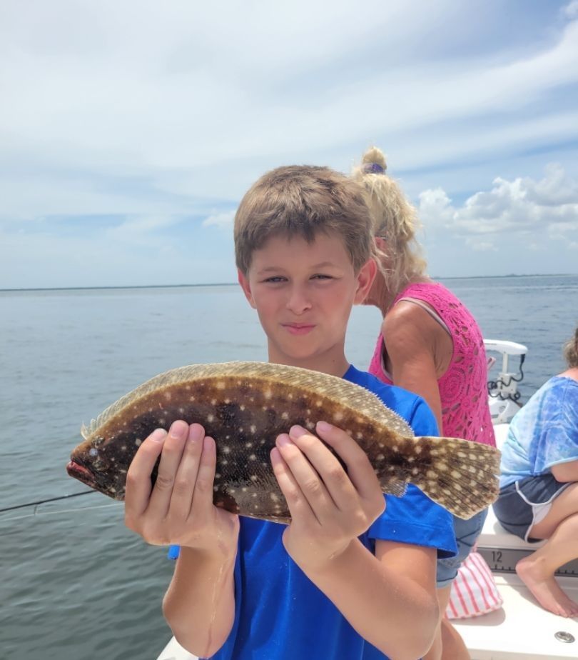 Fisherman catching a Southern Flounder