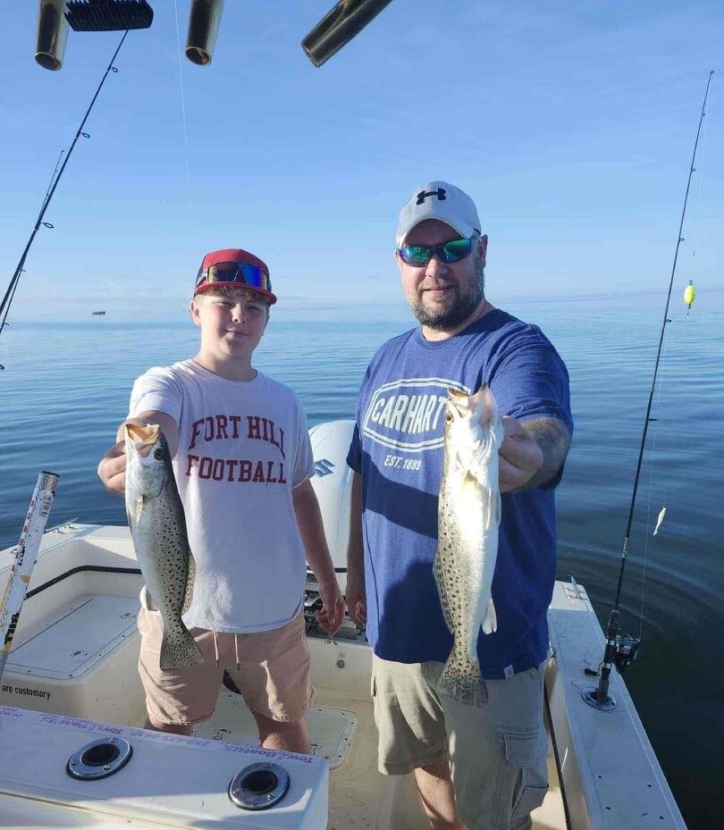 Two anglers fishing for spotted weakfish