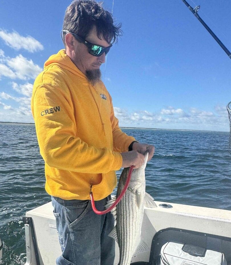 Striped bass caught during fishing trip on open water