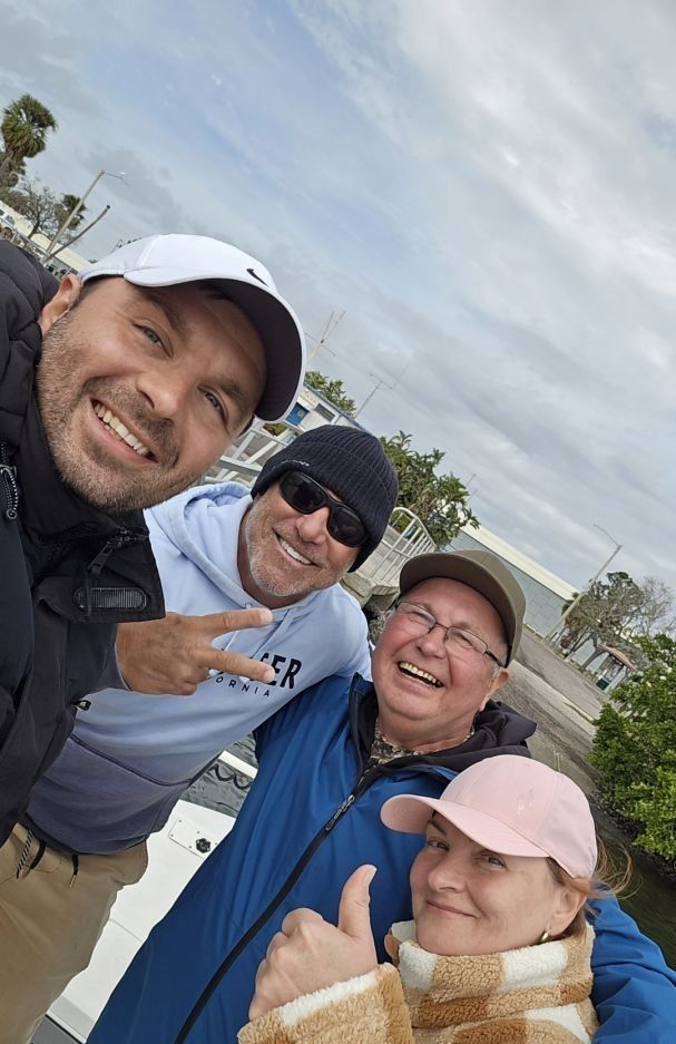 Four people enjoying a fishing trip