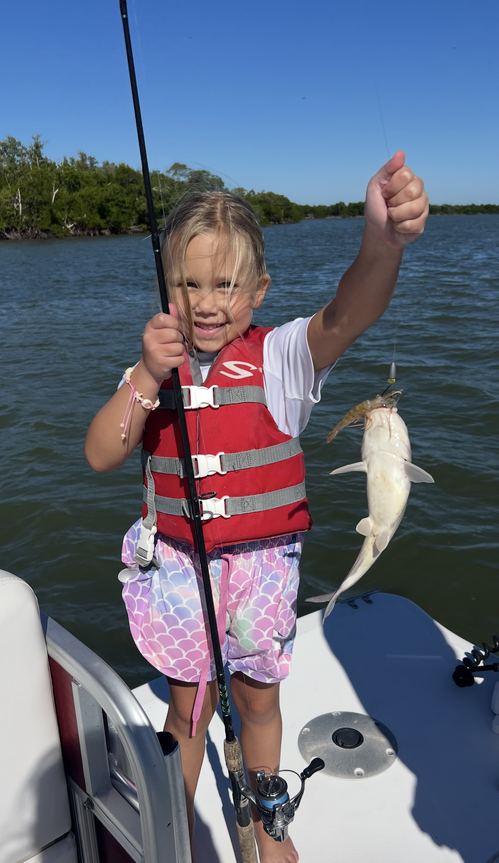 A person fishing in an unknown location