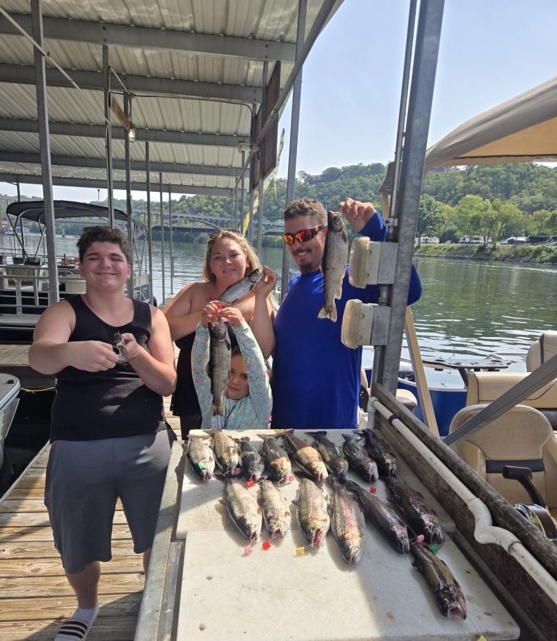 4 people fishing at unknown location