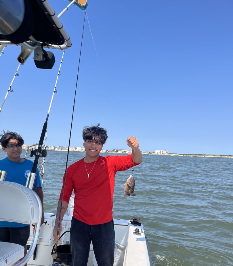 Two people fishing in an unspecified location