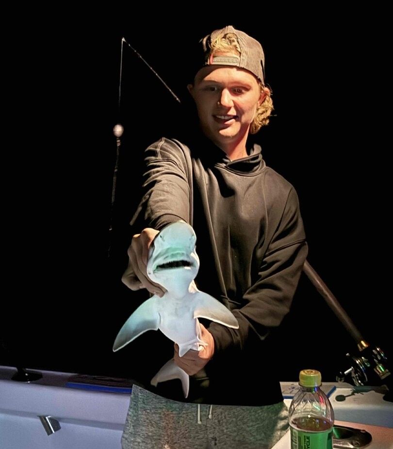 A person fishing in an unknown location