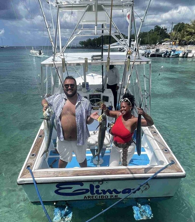Two people fishing at an unknown location